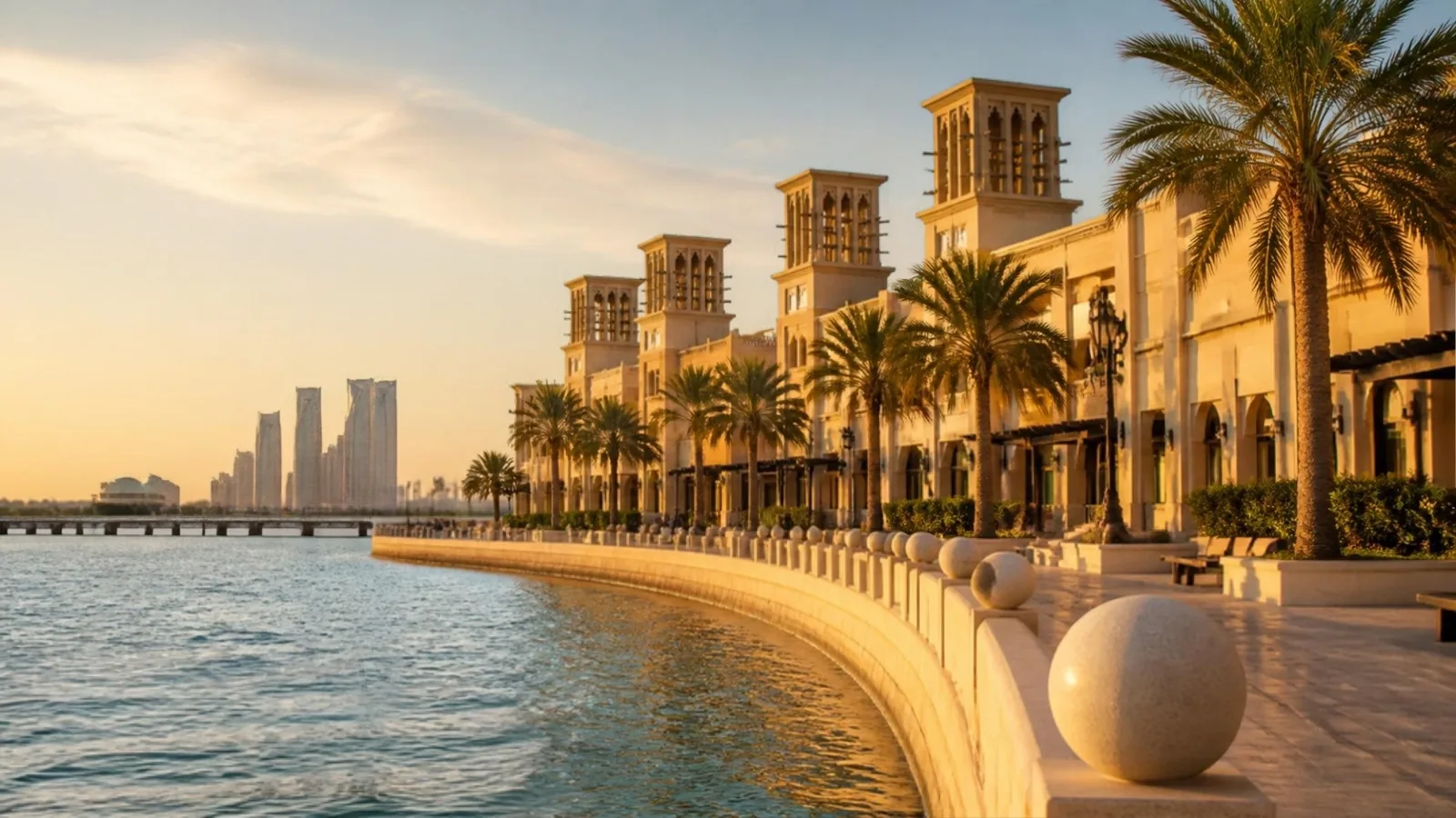 Gulf city waterfront at golden hour with palm trees and calm water — Abu Dhabi as the Etihad cabin crew home base