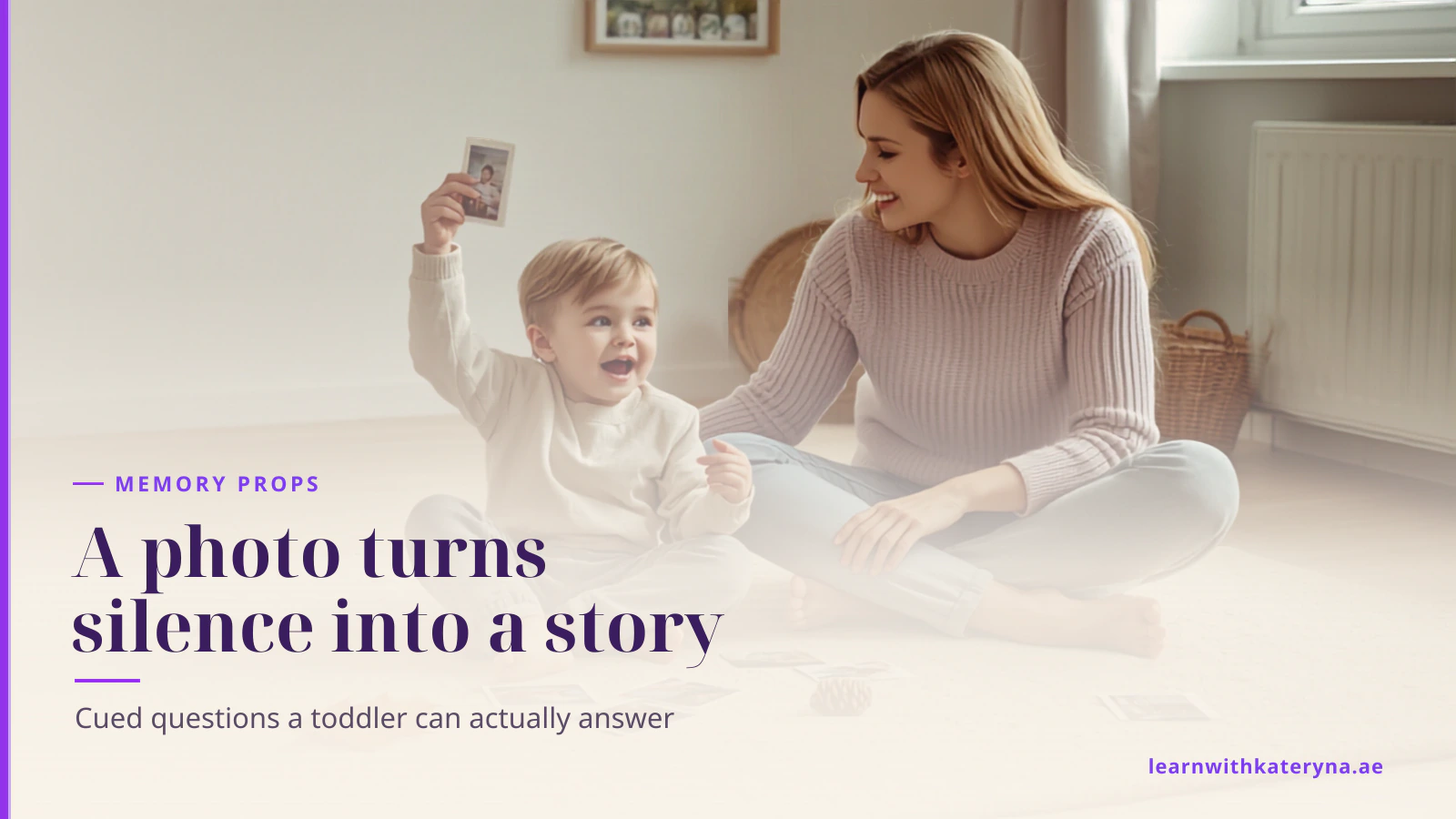 A mother and her toddler sit on a rug with printed photos, a pinecone and a leaf from their walk, and the boy points excitedly at one photo