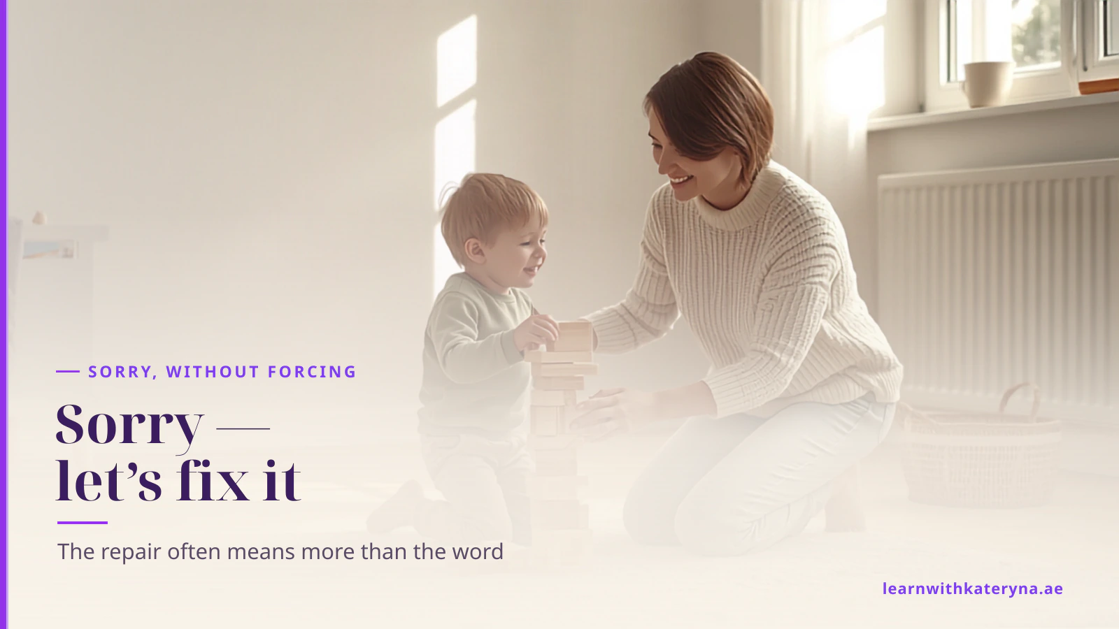 A mother kneels beside her young son on the floor as they rebuild a fallen block tower together after an accident